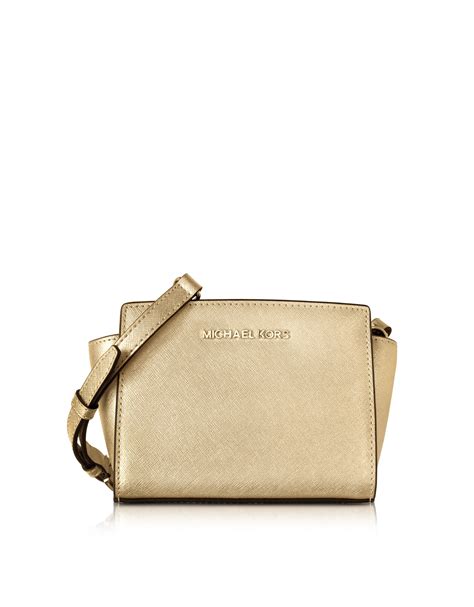 michael kors selma mini messenger pale gold|michael michael kors selma mini messenger .